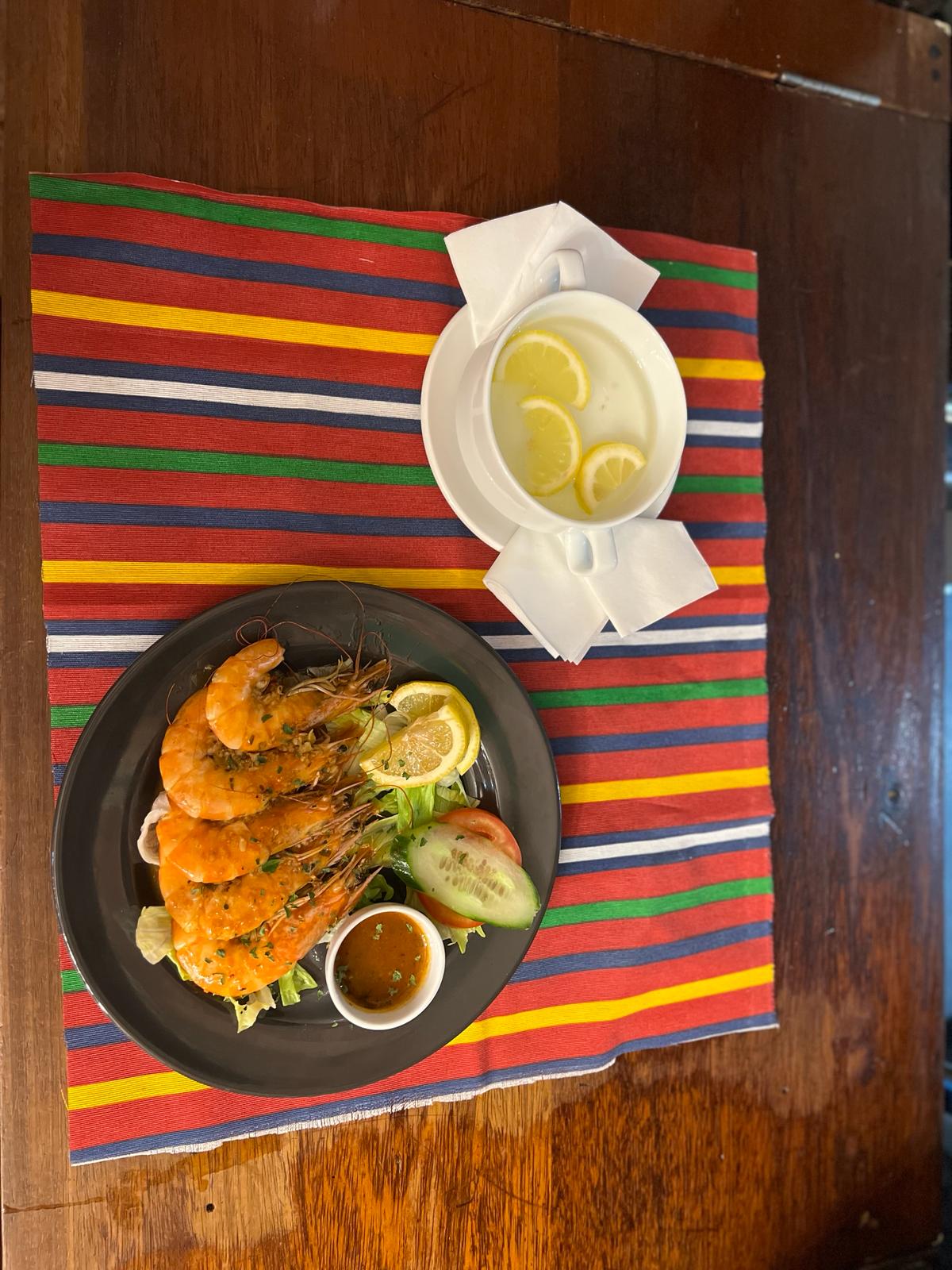 Our grilled prawns, with lemon and fresh salad